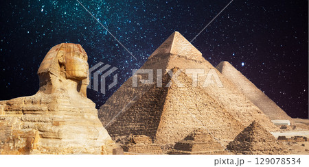 night scene of the castle pyramid in the desert 129078534