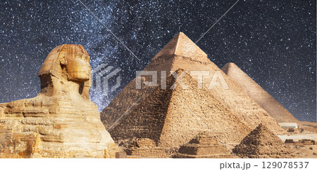 night scene of the castle pyramid in the desert 129078537