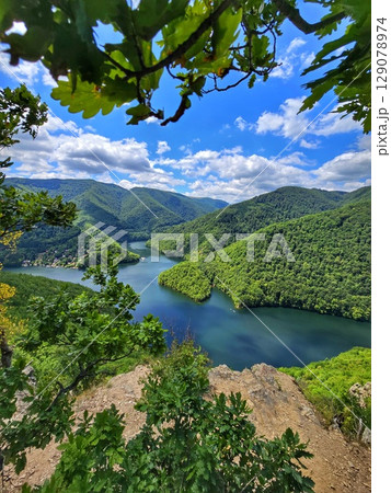 Piatra lui Lucaci hiking trail view over Tarnita Lake. Cluj, Romania 129078974