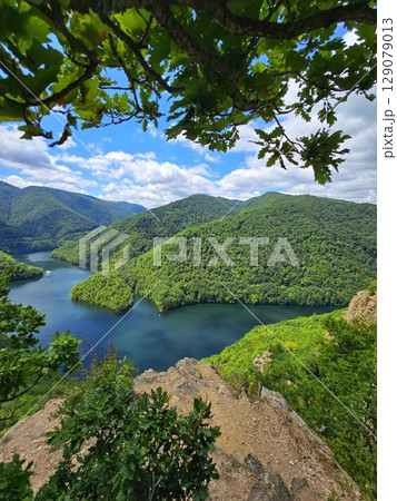 Piatra lui Lucaci hiking trail view over Tarnita Lake. Cluj, Romania 129079013