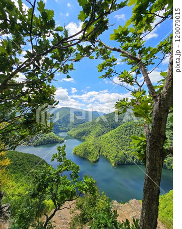 Piatra lui Lucaci hiking trail view over Tarnita Lake. Cluj, Romania Piatra lui Lucaci hiking trail view over Tarnita Lake. Cluj, Romania 129079015