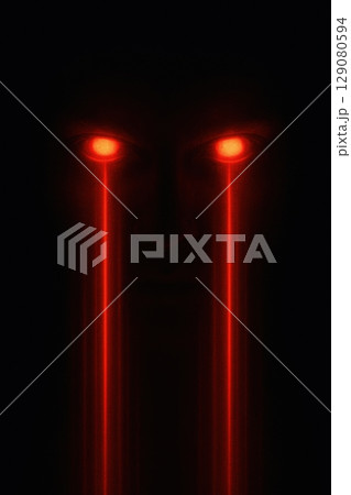 Glowing red laser eyes in dark mysterious atmosphere 129080594
