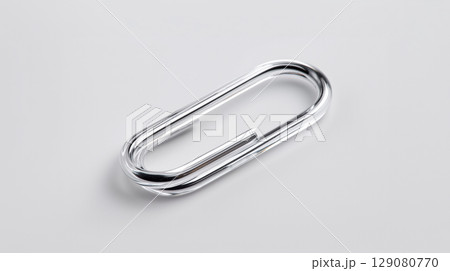 Shiny chrome connector or fastener isolated on a white background Shiny chrome connector or fastener isolated on a white background 129080770