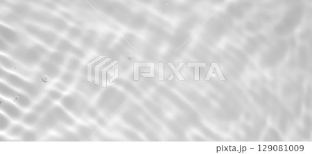 Abstract white transparent water shadow surface texture natural ripple background 129081009