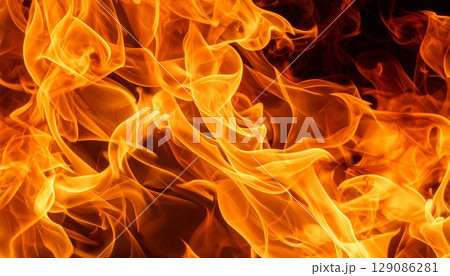 バトルや戦争や山火事などのイメージ　激しく燃え上がる炎のテクスチャと火の揺らめき 129086281