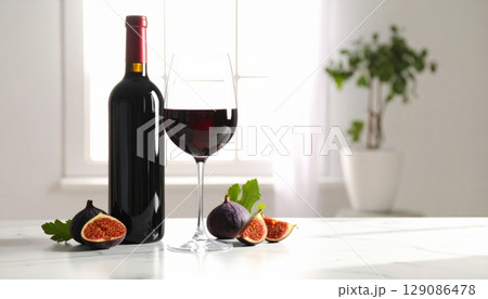 A gourmet still life with red wine, cheese, and fresh fruit on a dining table, perfect for a celebration meal A gourmet still life with red wine, cheese, and fresh fruit on a dining table, perfect for a celebration meal 129086478