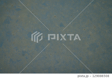 Worn blue surface with dust and grunge texture 129086508