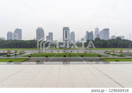 Jakarta, Indonesia - Mar 31,2024 : The National Monument is a 132m tower in the centre of Merdeka Square in Jakarta, Indonesia on Mar 31,2024. 129088416