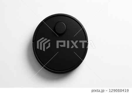 白い背景に置かれたシンプルな黒いロボット掃除機 129088419