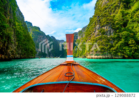 View of Pi Leh lagoon (also known as Green Lagoon) at Ko Phi Phi islands, Thailand. View from typical long tailed boat. Typical Thai picture of tropical paradise. Limestone rock and turquoise water. 129088872