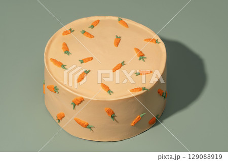 Round bento cake decorated with vibrant carrot designs on a smooth surface, showcasing a delightful dessert perfect for celebrations and special occasions with a charming aesthetic appeal Round bento cake decorated with vibrant carrot designs on a smooth surface, showcasing a delightful dessert perfect for celebrations and special occasions with a charming aesthetic appeal 129088919