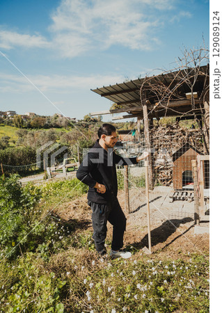 Tired Man In His Farm With The Hoe 129089124