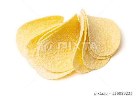 Round corn tortilla chips isolated on white studio background Round corn tortilla chips isolated on white studio background 129089223