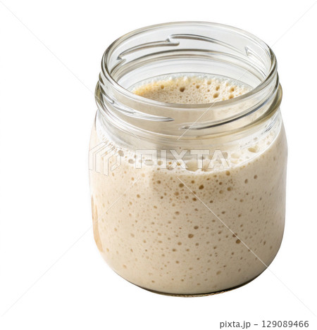 glass jar filled with bubbly sourdough starter, showcasing its active fermentation process, isolated on transparency background 129089466