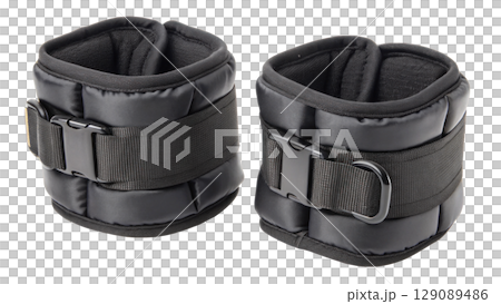 Black adjustable ankle weights for fitness training, featuring durable straps and soft padding for comfort, isolated on transparency background 129089486