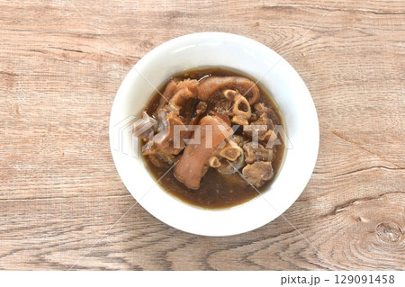 boiled braised salty pork leg in Chinese herb brown soup in bowl boiled braised salty pork leg in Chinese herb brown soup in bowl 129091458