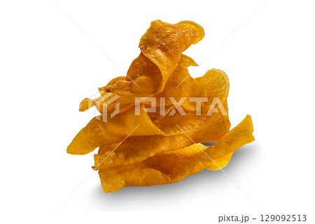 Pile of homemade sweet crispy potato chips isolated on white background with clipping path. Pile of homemade sweet crispy potato chips isolated on white background with clipping path. 129092513