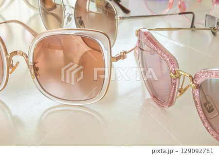 Sunglasses close up on white background Sunglasses close up on white background 129092781