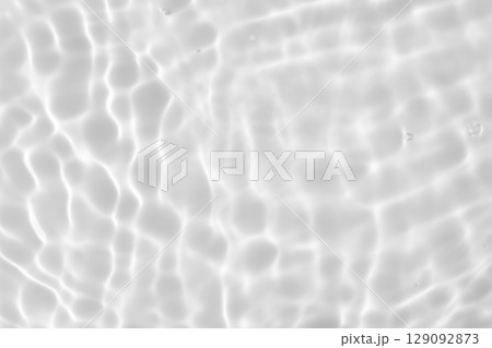 Abstract white transparent water shadow surface texture natural ripple background 129092873