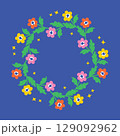 Vector illustration of a colorful floral wreath in doodle cartoon style, Hand-drawn bright flowers arranged in a circle on blue background, Decorative childlike nature design 129092962