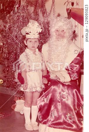 Small Soviet girl of five years old with a crown at Christmas in kindergarten in 1987 129093823