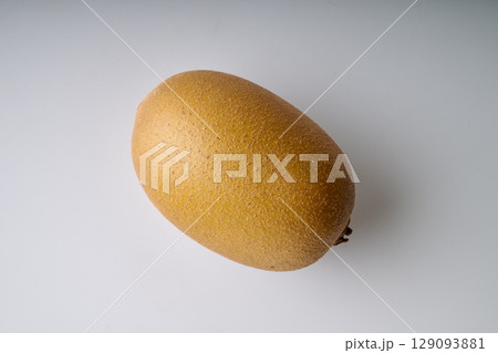 Yellow kiwi on white view from above Yellow kiwi on white view from above 129093881