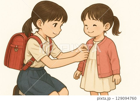 幼い妹の着替えを手伝う姉 129094760