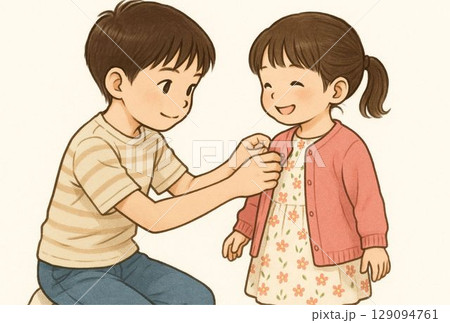 幼い妹の着替えを手伝う兄  129094761