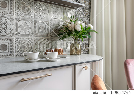Vintage Kitchen Counter with Flowers and Coffee Setup Vintage Kitchen Counter with Flowers and Coffee Setup 129094764