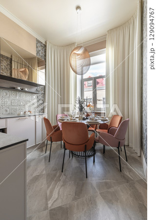Modern Kitchen Dining Area with Velvet Chairs and Pendant Light Modern Kitchen Dining Area with Velvet Chairs and Pendant Light 129094767