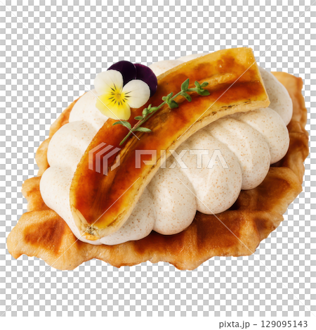 Caramelized banana waffle topped with whipped cream, edible flowers, and thyme for delightful dessert Caramelized banana waffle topped with whipped cream, edible flowers, and thyme for delightful dessert 129095143