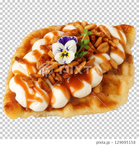 Delicious croffle topped with whipped cream, caramel sauce, nuts, and edible flower creates delightful treat Delicious croffle topped with whipped cream, caramel sauce, nuts, and edible flower creates delightful treat 129095158
