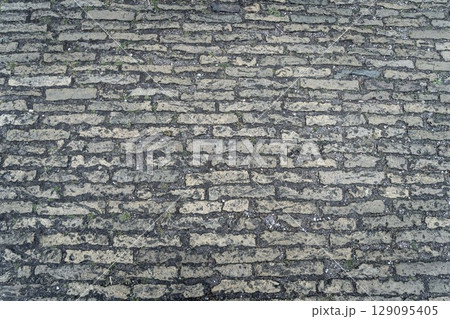 Red grunge brick wall, abstract background texture with old dirty and vintage style pattern Red grunge brick wall, abstract background texture with old dirty and vintage style pattern 129095405