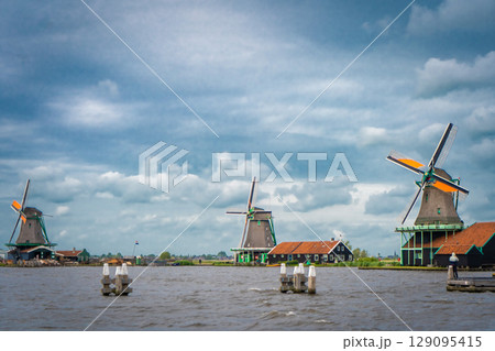 Traditional dutch windmill near the canal. Netherlands Traditional dutch windmill near the canal. Netherlands 129095415