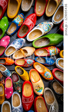 Clogs for sale at a Dutch retail shop. Wooden shoes are a well know traditional souvenir from Holland 129095436
