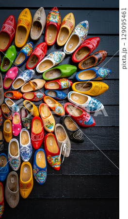 Clogs for sale at a Dutch retail shop. Wooden shoes are a well know traditional souvenir from Holland 129095461