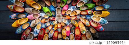 Clogs for sale at a Dutch retail shop. Wooden shoes are a well know traditional souvenir from Holland Clogs for sale at a Dutch retail shop. Wooden shoes are a well know traditional souvenir from Holland 129095464
