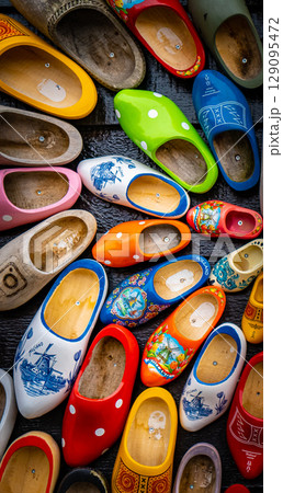 Clogs for sale at a Dutch retail shop. Wooden shoes are a well know traditional souvenir from Holland 129095472