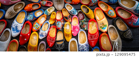 Clogs for sale at a Dutch retail shop. Wooden shoes are a well know traditional souvenir from Holland Clogs for sale at a Dutch retail shop. Wooden shoes are a well know traditional souvenir from Holland 129095475