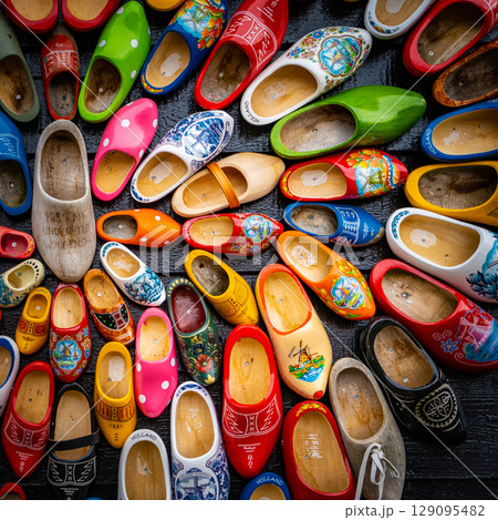 Set of different colorful vintage Dutch wooden clogs 129095482