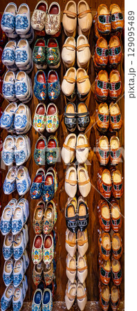 Set of different colorful vintage Dutch wooden clogs 129095489