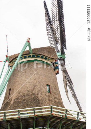 Mill by the river at dawn. Windmill at dawn. Early morning on windmill farm. Mill by river at dawn Mill by the river at dawn. Windmill at dawn. Early morning on windmill farm. Mill by river at dawn 129095511