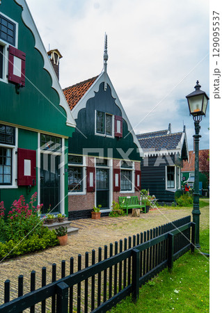 Authentic Zaandam mills on the water channel in Zaanse Schans willage. Zaanse Schans Windmills and famous Netherlands canals, Europe. 129095537