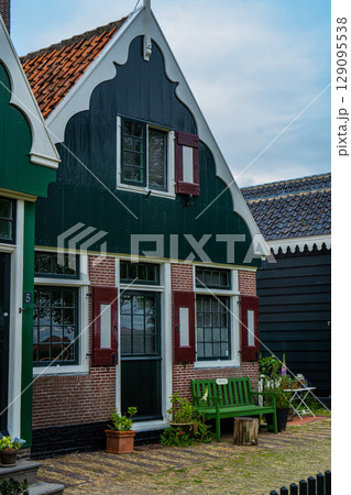 Authentic Zaandam mills on the water channel in Zaanse Schans willage. Zaanse Schans Windmills and famous Netherlands canals, Europe. 129095538