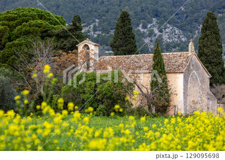 parish church Sant Miquel, chapel from the 13th century, near Campanet in front of the Tramuntana mountains, Mallorca, Balearic Islands, Spain, Europe parish church Sant Miquel, chapel from the 13th century, near Campanet in front of the Tramuntana mountains, Mallorca, Balearic Islands, Spain, Europe 129095698