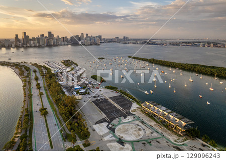 Biscayne Bay with luxury sailboats and yachts in Miami city in Florida, USA. Relaxing on ocean water at sunset Biscayne Bay with luxury sailboats and yachts in Miami city in Florida, USA. Relaxing on ocean water at sunset 129096243