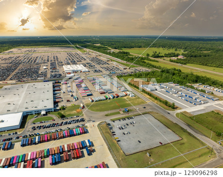 Automotive industry. Import or export of new cars at production factory warehouse. Vehicles for sale at logistics business parking lot Automotive industry. Import or export of new cars at production factory warehouse. Vehicles for sale at logistics business parking lot 129096298