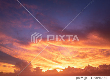 Amazing evening skyscape. Sunset sky with bright colorful clouds 129096330
