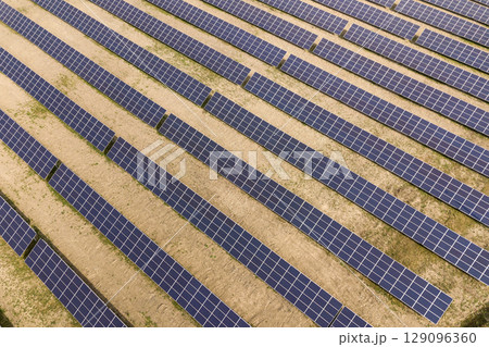 Aerial view of solar power plant. Electric panels for producing clean ecologic energy. Aerial view of solar power plant. Electric panels for producing clean ecologic energy. 129096360