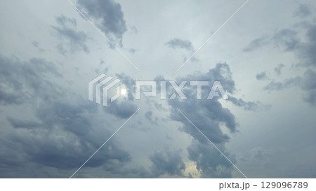 Blue clouds and sun in the sky Blue clouds and sun in the sky 129096789